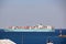 Different types of vessels calling at the port and standing at the pier. Tugboats at the port. Jeddah Port, Saudi Arabia.