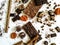 Different varieties of chocolate, chocolate tubes and cocoa on a white table