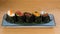 Different varieties of gunkan wrapped in nori seaweed, bluefin tuna tartare, caviar of different sizes and colours avocado, sea