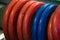 Different weight, red and blue weight plates for the barbell. Weightlifting