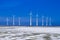 Different windmills in winter landscape