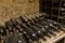 Different years of wine bottles in a distillery cellar