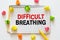 Difficulty breathing - the word is written on a wooden board