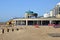 Digger moving shingle on Eastbourne beach