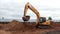 Digger truck takes soil with bucket at construction site