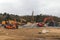 Diggers and dumper trucks on a construction site