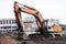 Digging excavator machine at building construction site