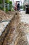 Digging road before install Pipe Water. Excavation water drainage at construction site. Digging roads to lay pipes 8 inches. The r