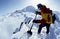 Digging in snow on a mountain top in Alaska