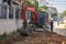 Digging a trench excavator. Excavation work in the summer.