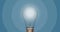 Digital animation of bright bulb moving back and forth against blue background