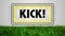 Digital animation of kick text on neon banner over grass against grey background