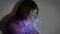 Digital animation of upset woman covering her face. Illuminated bubbles on foreground.