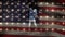 Digital animation of victorious rugby player with hands raised against the American flag