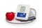 Digital blood pressure meter with love heart symbol on white background