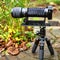 Digital camera with bellows and zoom lens on a pocket tripod, macro photography arrangement