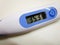 Digital clinical thermometer showing body temperature