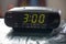 Digital clock closeup displaying 3:00 o`clock.