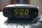 Digital clock closeup displaying 5:00 o`clock.