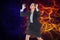 Digital composite image of angry businesswoman with fire