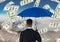 Digital composite image of businessman holding blue umbrella while standing amidst currencies