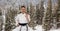 Digital composite image of caucasian female marital artist with black belt against winter landscape