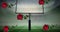 Digital composite image of falling red roses against goal post on american football field