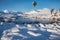 Digital composite image of hot air balloons flying over Beautiful Winter landscape image looking towards Scottish Highlands