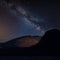 Digital composite image of Milky Way night sky over Landscape view across Derwentwater from Manesty Park towards Blencathra and
