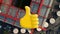 Digital composition of thumbs up icon against aerial view of warehouse in the city