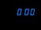 Digital countdown at zero, blue figures on black blackground. Timer, minutes.