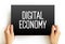 Digital Economy is an economy that is based on digital computing technologies, text concept on card