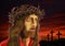 Digital illustration of Jesus Christâ€™s face, on reddish sunset
