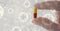 Digital illustration of person holding a medical pill over macro Coronavirus Covid-19 cells floating