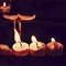 Digital illustration of three candles on dark background. Home altar or church. Wax melting under fire