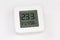 Digital indoor mini thermometer with hygrometer on a white surface