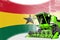 Digital industrial 3D illustration of green advanced grain combine harvester on Ghana flag - agriculture equipment innovation