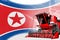 Digital industrial 3D illustration of red advanced farm combine harvester on North Korea flag - agriculture equipment innovation