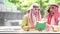 Digital marketing group arab people using smartphone n  modern muslim UAE city touch screen discussion. Entrepreneur As