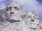 Digital mosaic of small images comprising Washington and Jefferson on Mt. Rsuhmore
