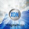 digital note xdn coin cryptocurrency in bright rays with statistics chart