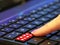 Digital online internet fake news red button finger push pressing press pushing keyboard switch