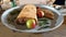 Digital painting style representing a tray with a meat pie with apples and green beans and a tray with boiled eggs in the