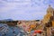 Digital painting style that represents a glimpse of the seaside village and the small port of Procida, outside Naples