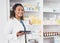 Digital tablet, portrait and woman pharmacist in a medication dispensary at the medicare clinic. Happy, smile and female