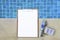 Digital water tester with blank white paper on wood clipboard