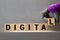 DIGITAL word inscription on wooden cube blocks on a white glossy background with reflection