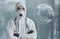 Digital world map on picture. Male doctor scientist in lab coat and mask standing indoors