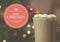 Digitally composite image of merry christmas against a cup of hot chocolate