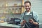 Digitizing the entrepreneurial experience. a young man using a digital tablet in the store that he works at.